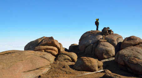 Man on rocks in Antarctica